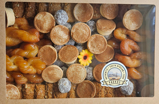 Assorted cookies in a box with a visible brand logo.